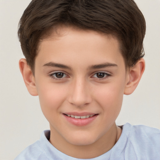 Joyful white child male with short  brown hair and brown eyes