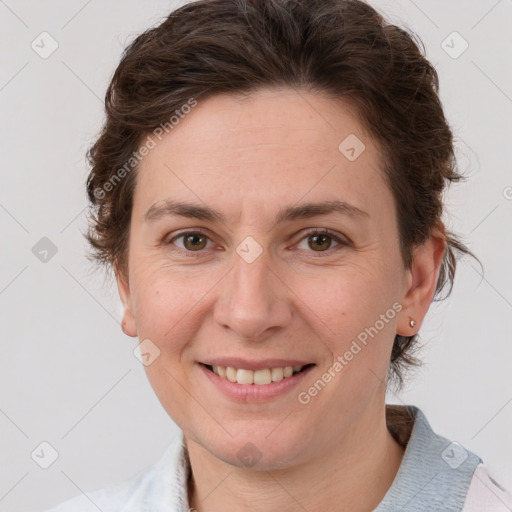 Joyful white adult female with short  brown hair and brown eyes