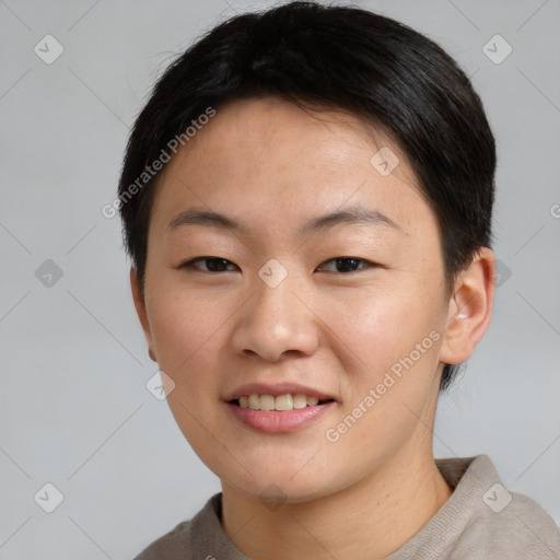 Joyful asian young-adult female with short  brown hair and brown eyes