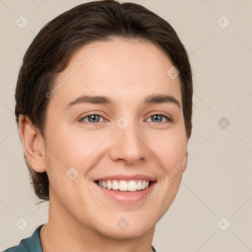 Joyful white young-adult female with short  brown hair and grey eyes