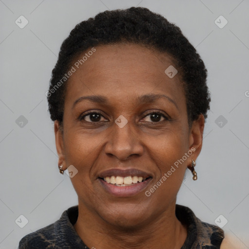 Joyful black adult female with short  brown hair and brown eyes