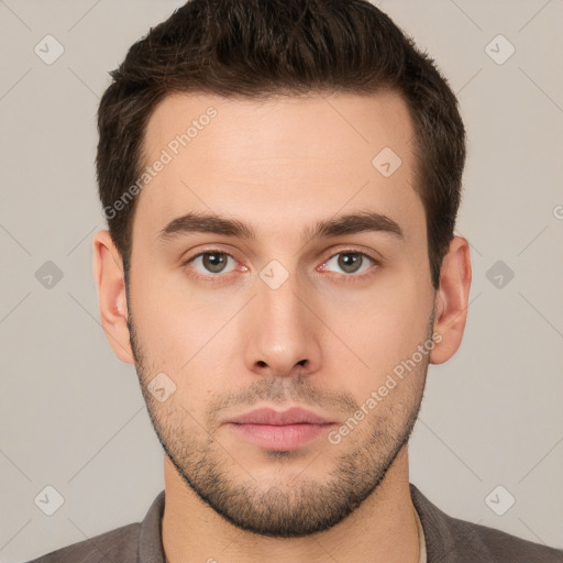 Neutral white young-adult male with short  brown hair and brown eyes