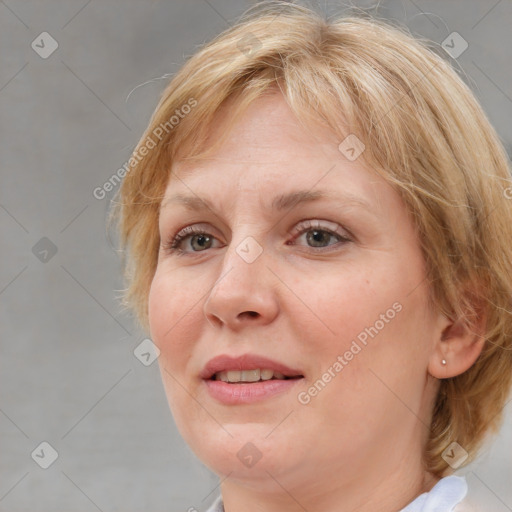 Joyful white adult female with medium  brown hair and blue eyes