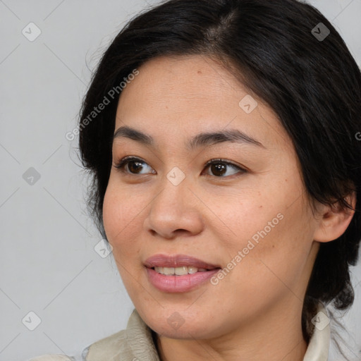 Joyful asian young-adult female with medium  brown hair and brown eyes