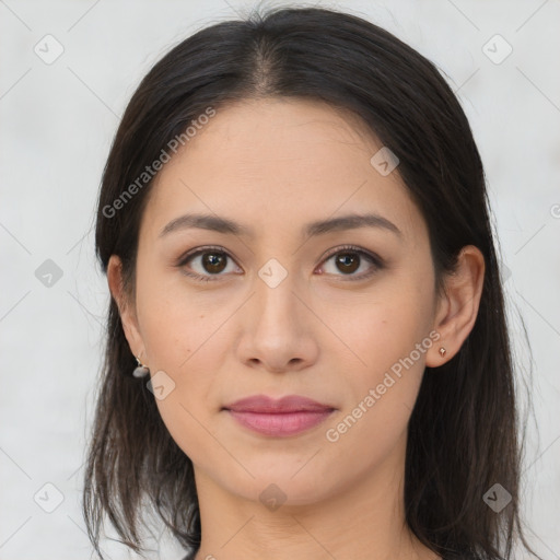 Joyful latino young-adult female with medium  brown hair and brown eyes