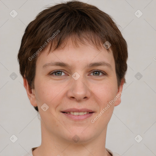 Joyful white young-adult female with short  brown hair and grey eyes