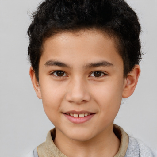 Joyful white child male with short  brown hair and brown eyes