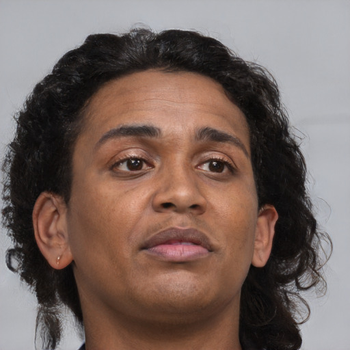 Neutral asian adult male with medium  brown hair and brown eyes