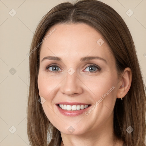 Joyful white young-adult female with long  brown hair and grey eyes