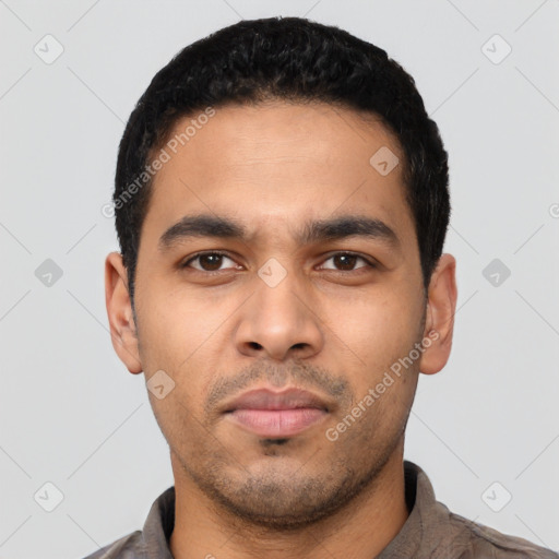 Neutral latino young-adult male with short  black hair and brown eyes