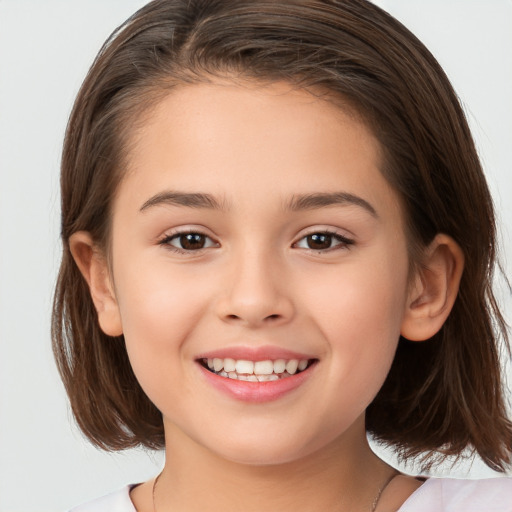 Joyful white child female with medium  brown hair and brown eyes