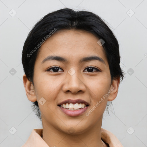 Joyful asian young-adult female with short  black hair and brown eyes