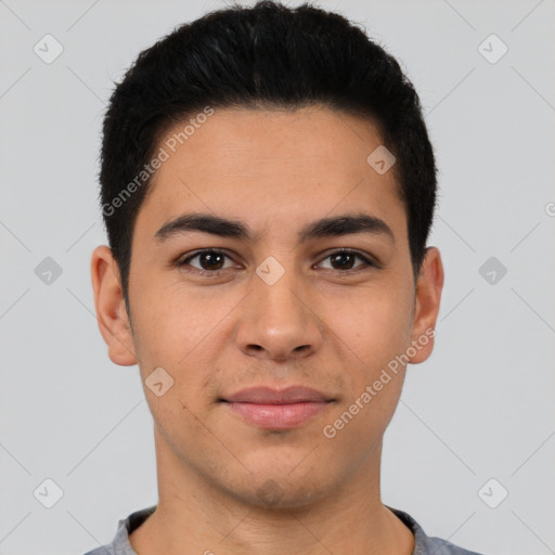 Joyful latino young-adult male with short  brown hair and brown eyes