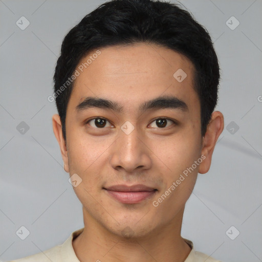 Joyful latino young-adult male with short  black hair and brown eyes