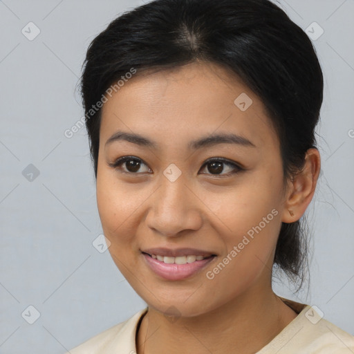 Joyful asian young-adult female with medium  brown hair and brown eyes