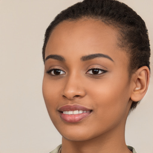 Joyful latino young-adult female with short  brown hair and brown eyes