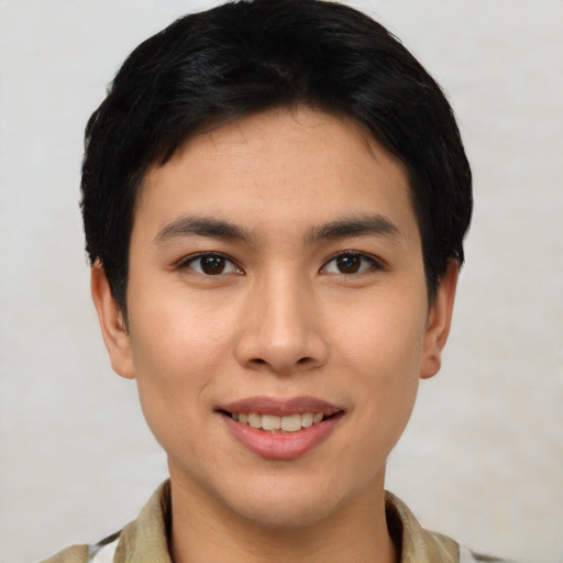 Joyful asian young-adult female with short  black hair and brown eyes
