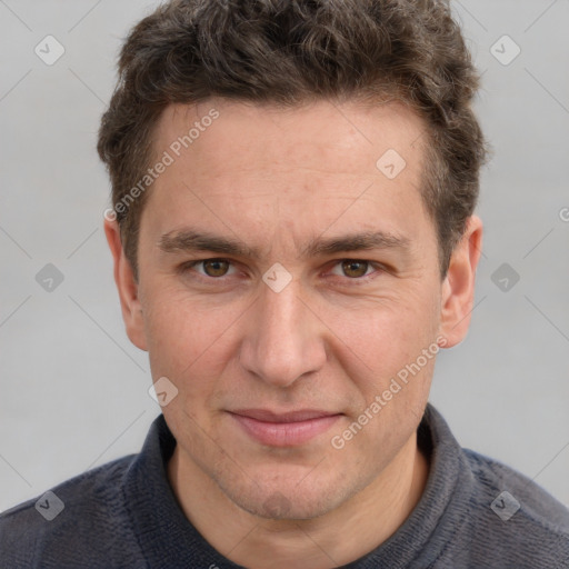 Joyful white adult male with short  brown hair and grey eyes