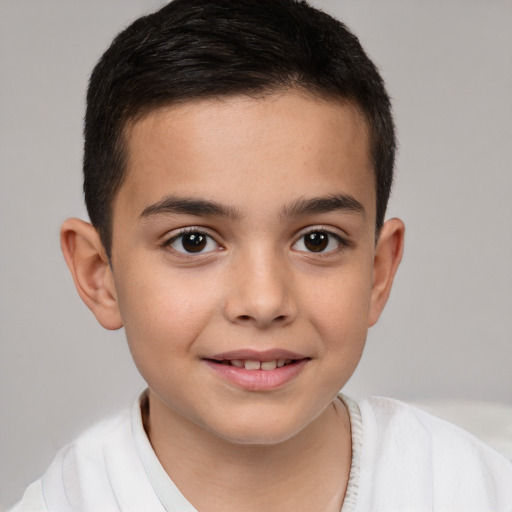 Joyful white child male with short  brown hair and brown eyes