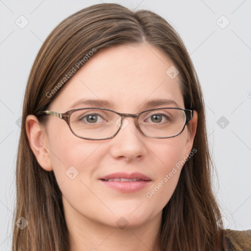 Joyful white young-adult female with long  brown hair and blue eyes