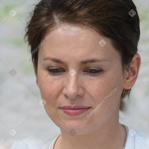 Joyful white adult female with short  brown hair and brown eyes