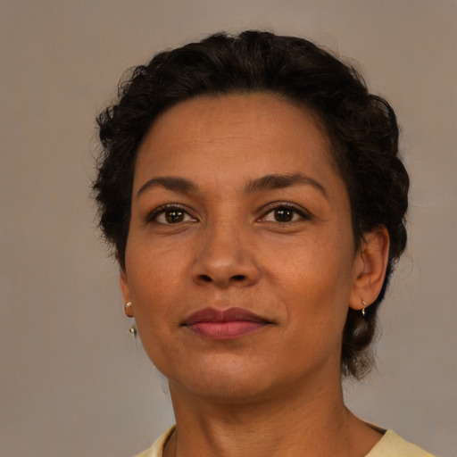 Joyful latino adult female with short  brown hair and brown eyes