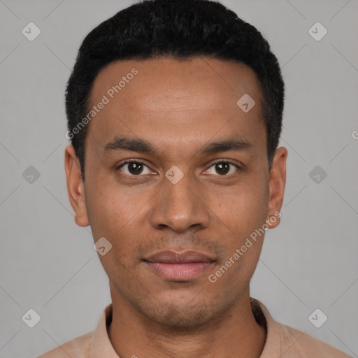Joyful latino young-adult male with short  black hair and brown eyes