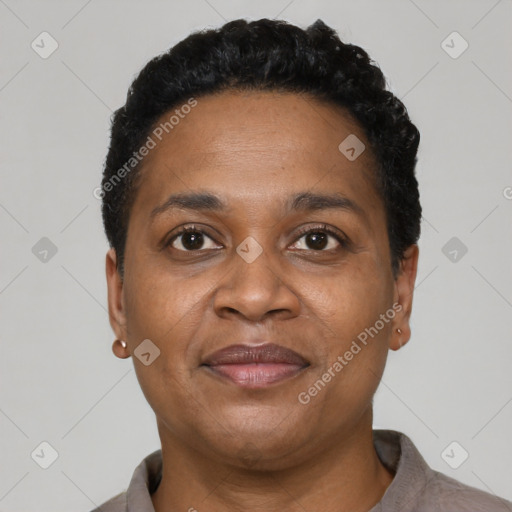 Joyful black adult female with short  black hair and brown eyes