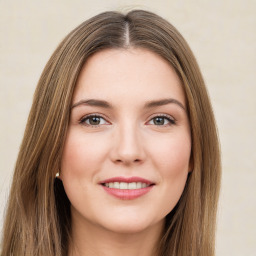 Joyful white young-adult female with long  brown hair and green eyes