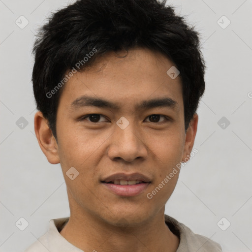 Joyful white young-adult male with short  black hair and brown eyes