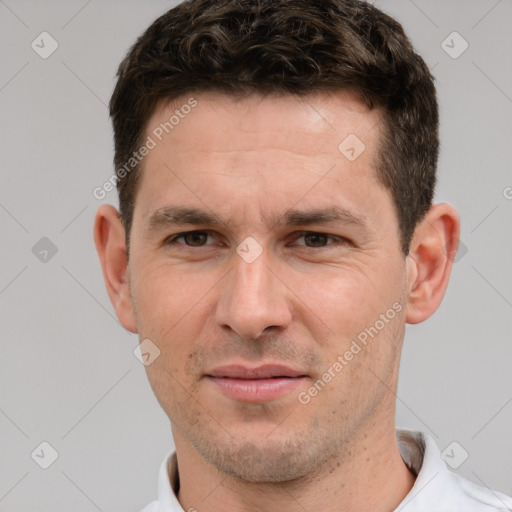 Joyful white adult male with short  brown hair and brown eyes