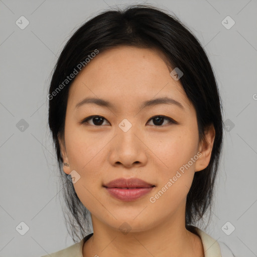 Joyful asian young-adult female with medium  black hair and brown eyes