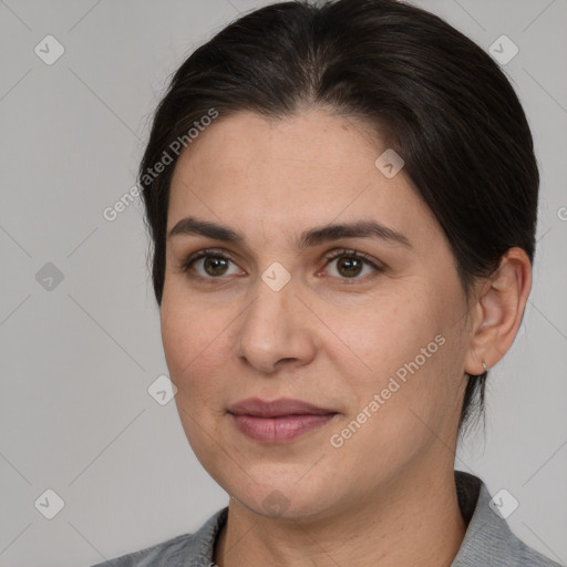 Joyful white adult female with medium  brown hair and brown eyes