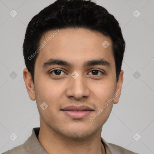 Joyful white young-adult male with short  black hair and brown eyes