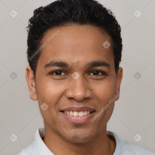 Joyful latino young-adult male with short  black hair and brown eyes