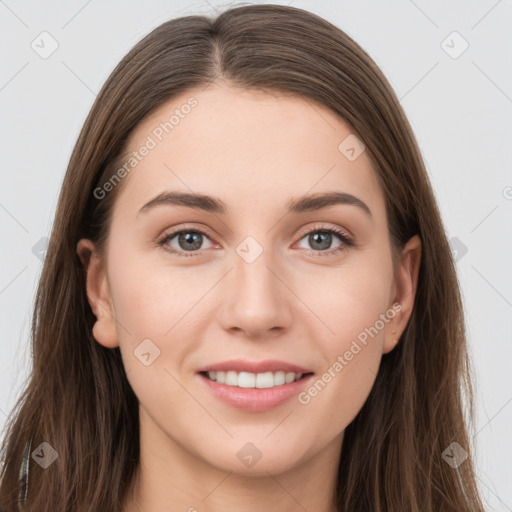 Joyful white young-adult female with long  brown hair and grey eyes