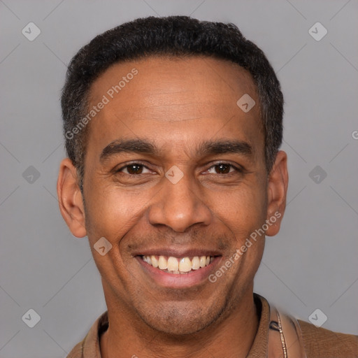 Joyful latino adult male with short  black hair and brown eyes