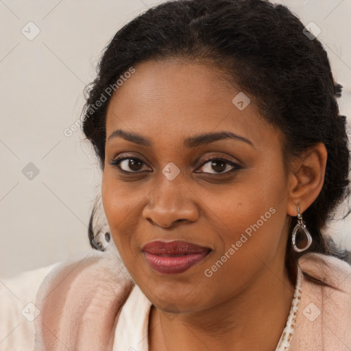 Joyful black young-adult female with long  brown hair and brown eyes