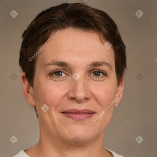 Joyful white adult female with short  brown hair and grey eyes