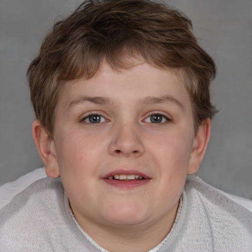 Joyful white child male with short  brown hair and brown eyes