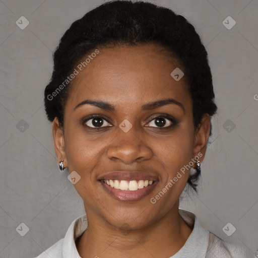 Joyful black young-adult female with short  black hair and brown eyes