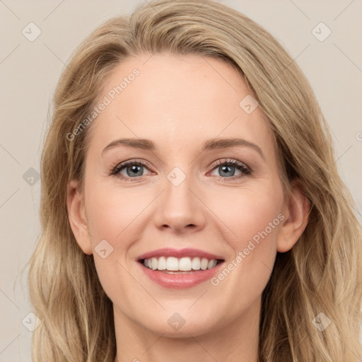 Joyful white young-adult female with long  brown hair and green eyes