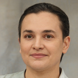 Joyful white adult female with short  brown hair and brown eyes