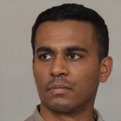 Neutral black young-adult male with short  black hair and brown eyes