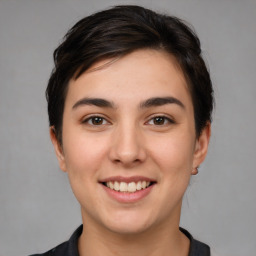 Joyful white young-adult female with medium  brown hair and brown eyes