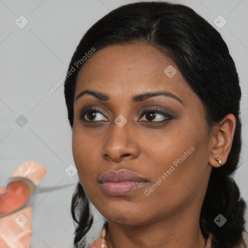 Neutral black young-adult female with medium  black hair and brown eyes