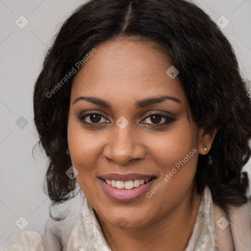 Joyful black young-adult female with long  brown hair and brown eyes