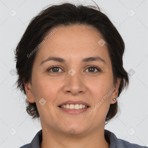 Joyful white adult female with medium  brown hair and brown eyes