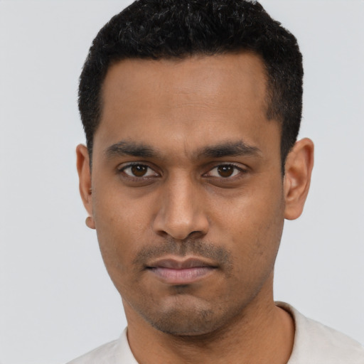 Neutral latino young-adult male with short  black hair and brown eyes