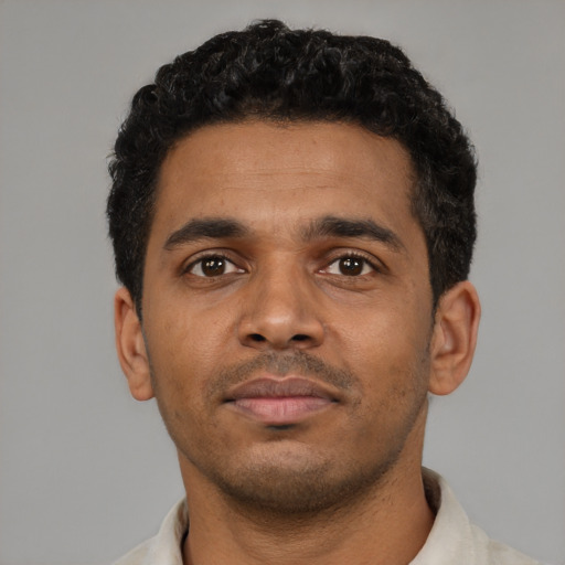 Neutral black young-adult male with short  black hair and brown eyes